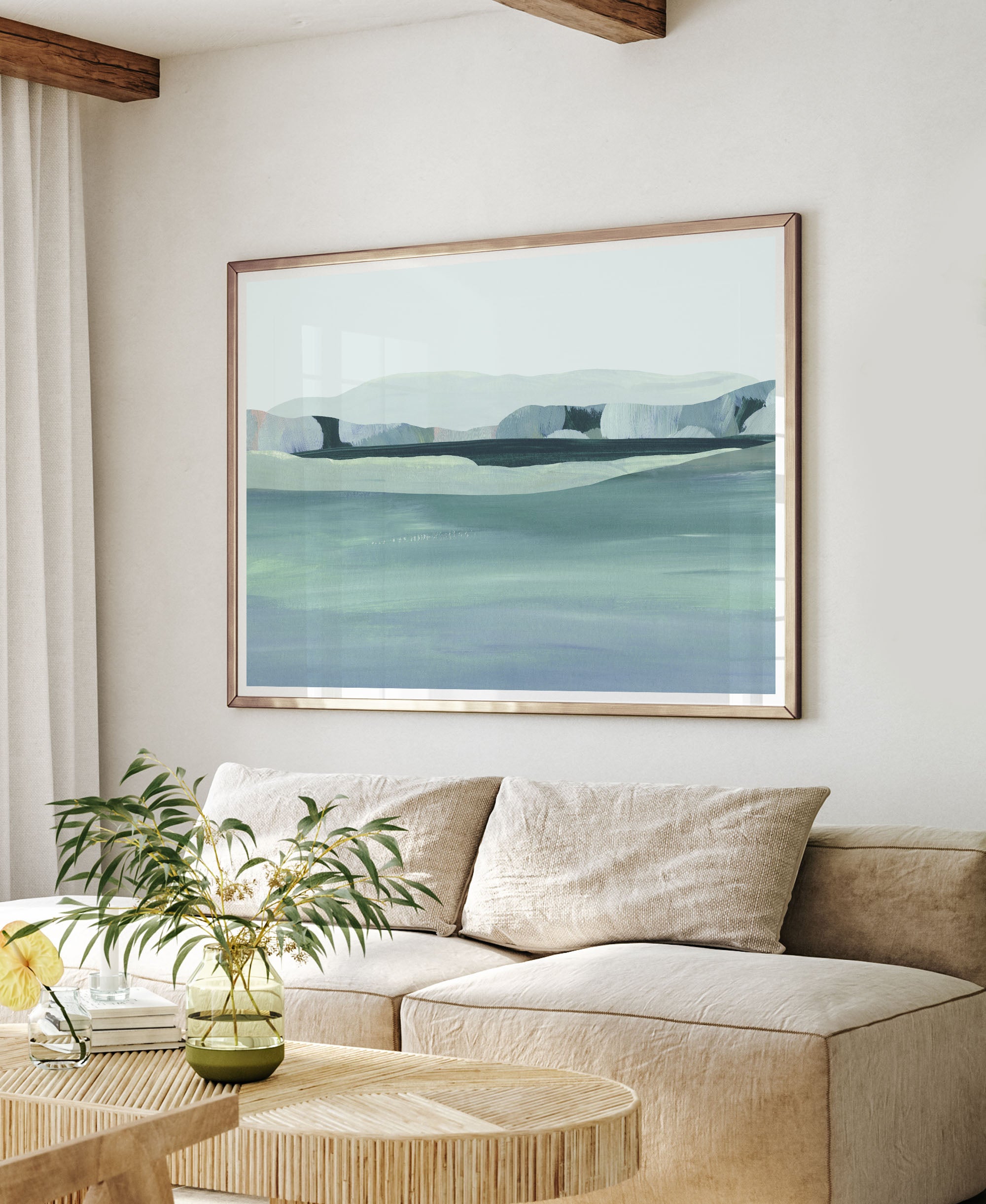 modern landscape painting above couch